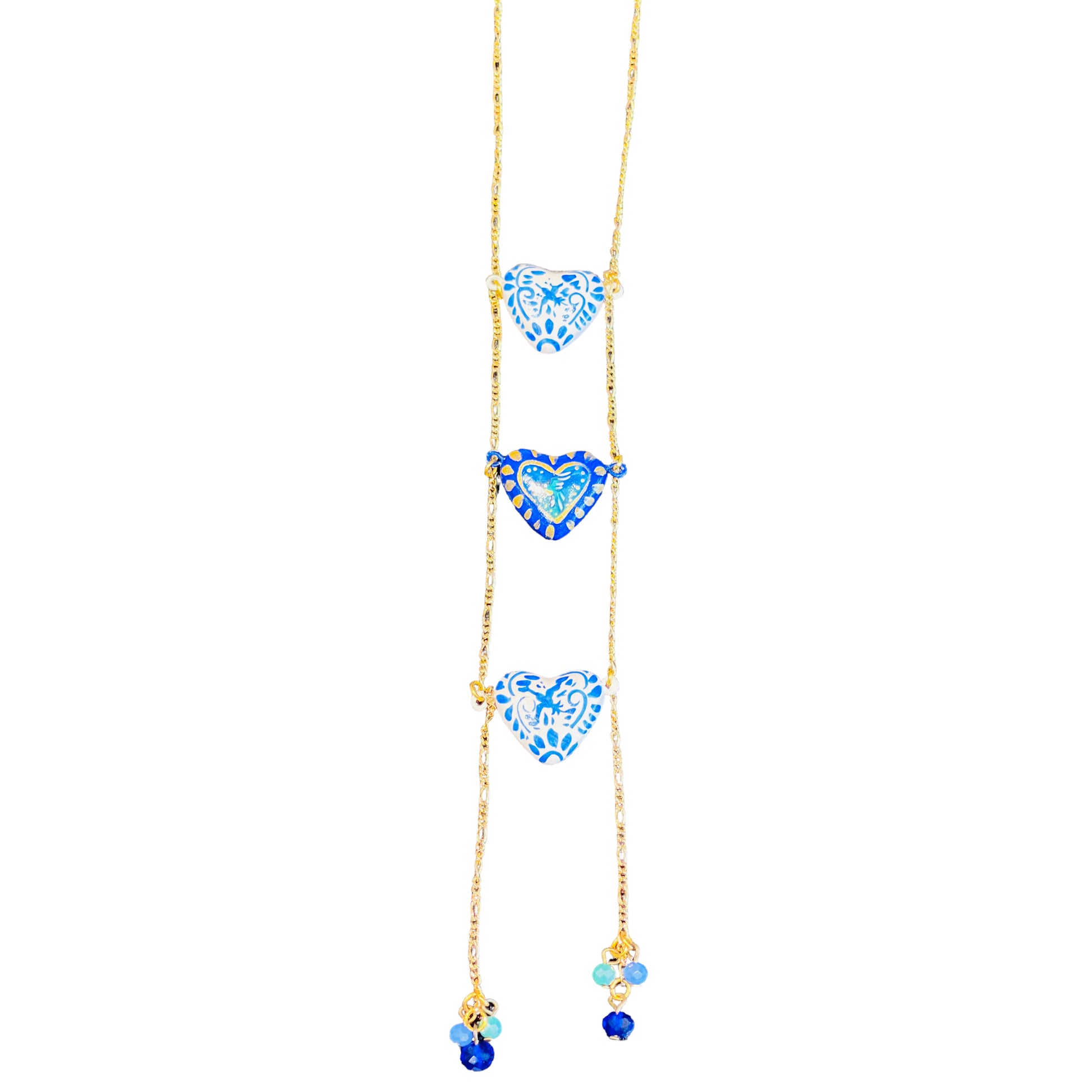 Triple blue and white heart necklace hand painted with different designs.