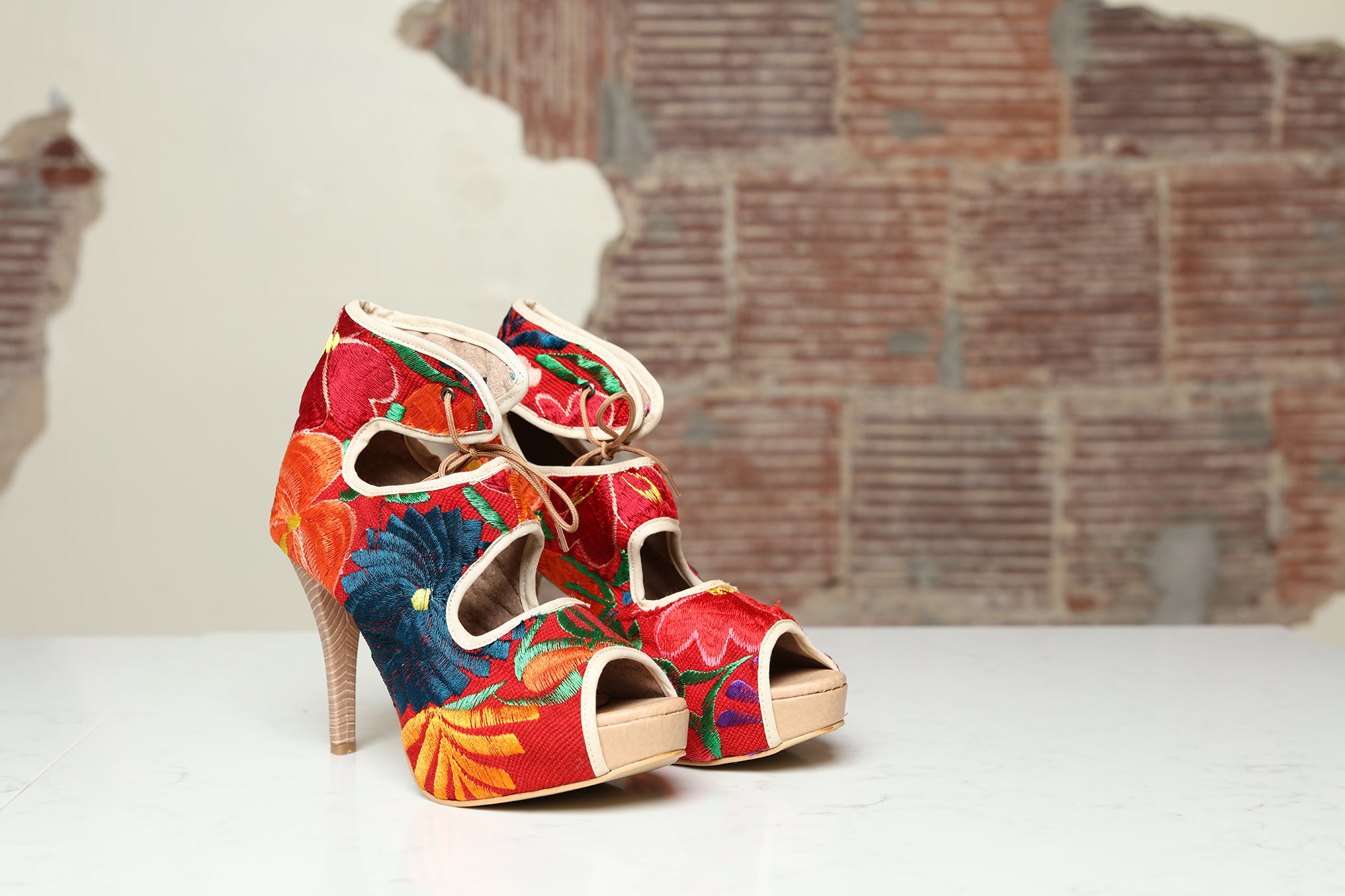 High heels with blue, red, blue and yellow floral embroidery