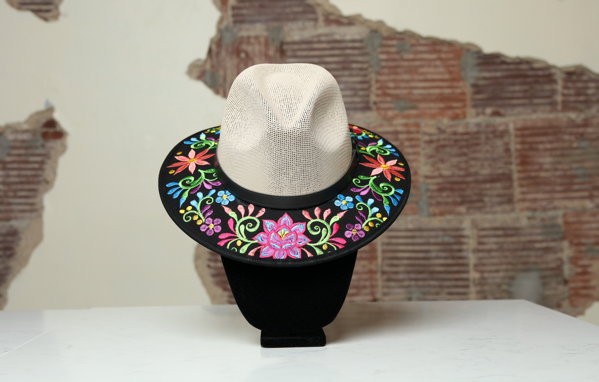 Hand embroidered cream brimmed hat, the perfect accessory to add fun and style to any outfit. With embroidered flowers and leaves in different colors as multicultural embellishments.