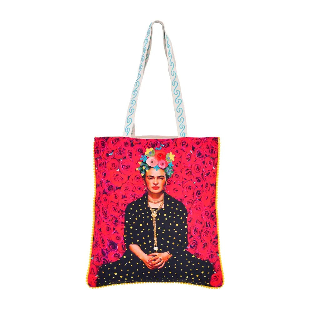 The multicultural red tote bag is decorated with roses and in the centre of the bag is an illustration of Frida Kahlo with a black dress and yellow dots. 