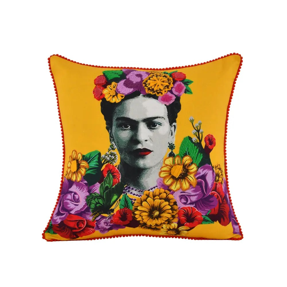 Hand embroidered yellow pillow with the image of Frida Kahlo in the center. Around it is decorated with beautiful flowers of different colors, and as a decoration of the pillow it has a red border. 