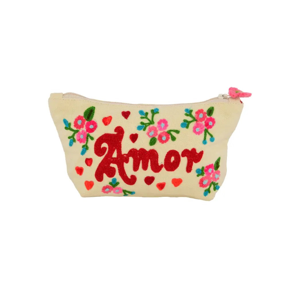 White embroidered purse design with the word amor in the center in red. All around are embroidered small flowers and the clasp has a pink flower detail.