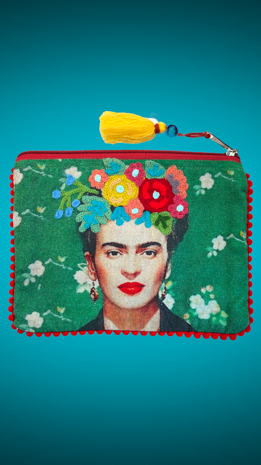 Green purse designs embroidered with the image of Mexican artist Frida Kahlo in the center. 