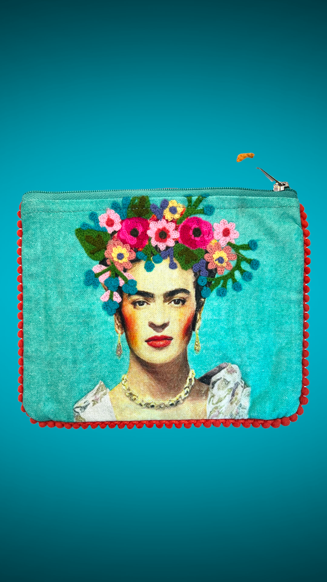 Teal purse designs embroidered with the image of Mexican artist Frida Kahlo in the center.
