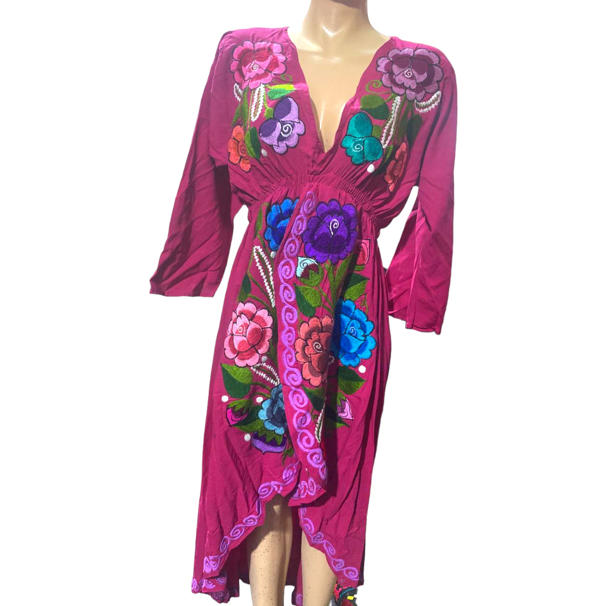 Pink long-tailed dress with embroidered flowers of different sizes in purple and blue.