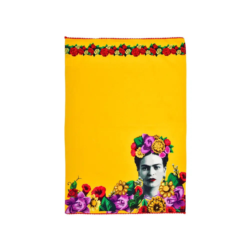 Yellow embroidered towel with the image of Mexican artist Frida Kahlo in the right corner. On the upper part there is a border of red roses and it is embroidered with purple and red flowers of different sizes.