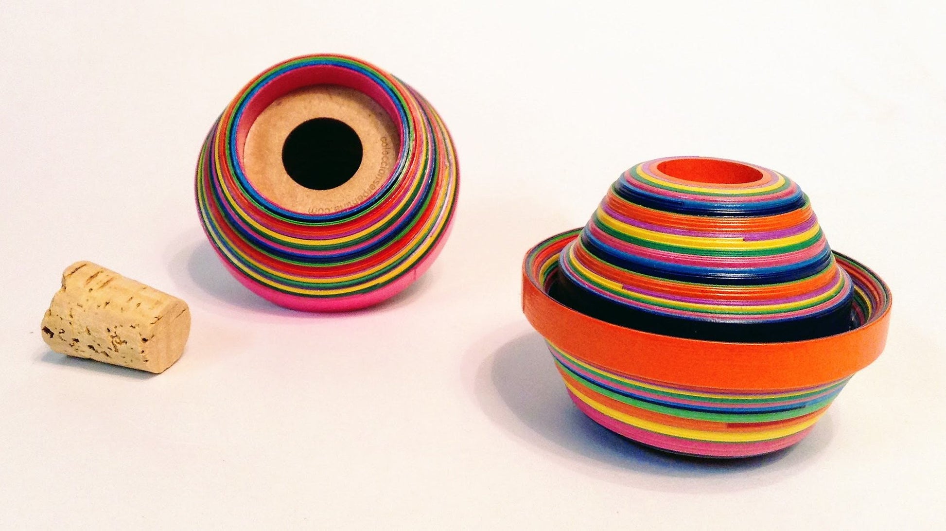 Multicolored serpentine salt and pepper shaker with a cork on the right side